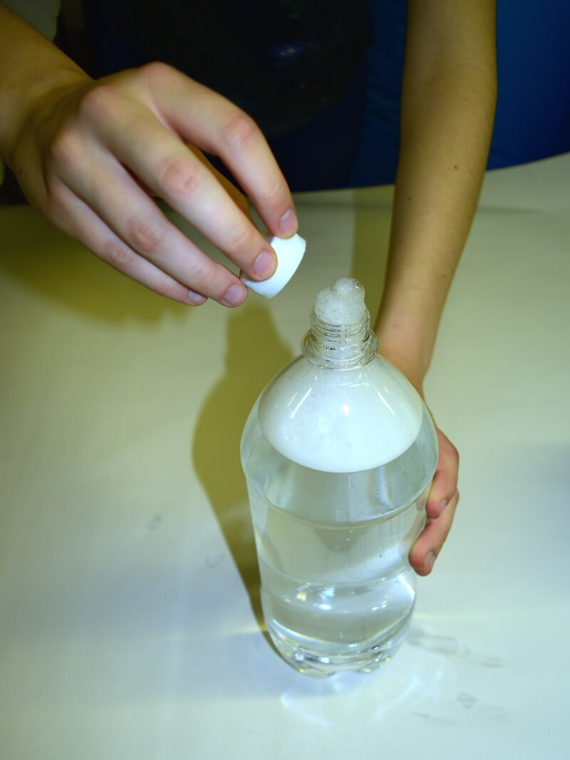 putting the cap on the soap mix